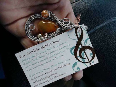 Shult's notes read: 'Free Art - Take Me - I'm Yours: This was left for you to find. A random act of being kind. Today the universe has chosen you to receive this gift abandoned here. Pick it up, keep it, pass it on or leave it.' (Image Courtesy of Natalie Shult)