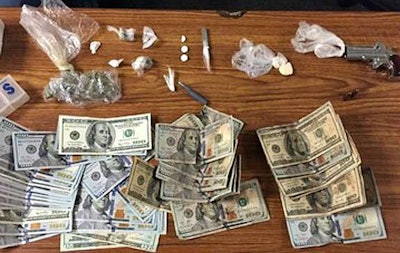 Drugs, cash and pistol taken during the arrest. (Indiana State Police photo)