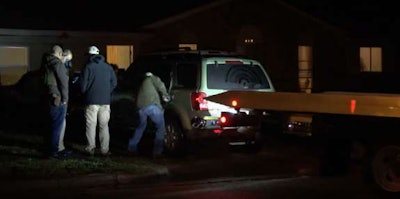 Law enforcement officials at scene of Wednesday night’s arrest in Hutchins, Texas.