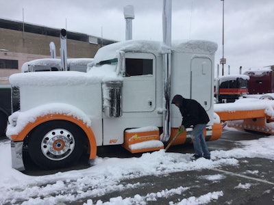 Dom Falson shovels around the 2007 Peterbilt 379 Dreamsicle