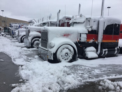 Snow-covered PKY Truck Beauty Contest entrants lined up at MATS
