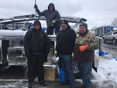 Taking a break from shoveling at MATS (from left) Jay Holsomback, Jason West, David Talley and Daniel Jolly.