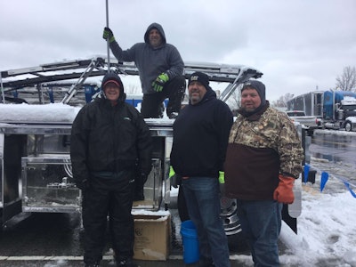 Taking a break from shoveling at MATS (from left) Jay Holsomback, Jason West, David Talley and Daniel Jolly.