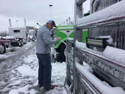 Daryl Couch brushes snow of his 2015 Western Star