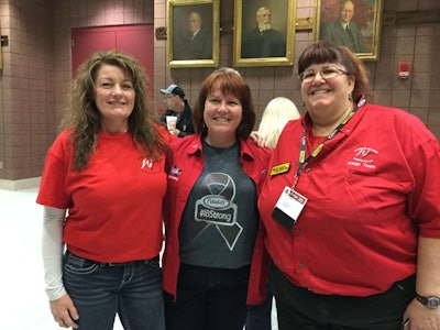 Walmart driver Carl Nixon, H.O. Wolding's Julie Matulle and J.B. Hunt's Jodi Edwards at the Women In Trucking gathering at MATS. Matulle wears a t-shirt promoting a fund-raising effort for Ingrid 'Half Pint' Brown who is battling cancer. https://www.youcaring.com/ingridbrown-1076550