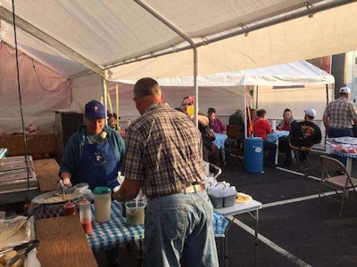 Truckers come together at the “Cause We Can” Cafe to enjoy a free meal and one another’s company.