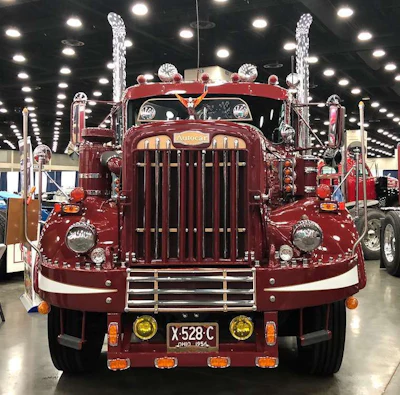 Howard's Autocar is red with white and orange detailing.