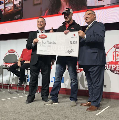 Josh Hainstock, center, won $10,000 for being a SuperFan contest finalist.
