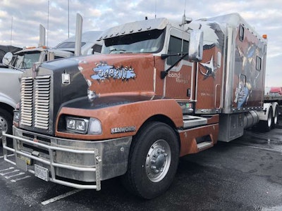 Landstar Ranger Inc.'s Kenworth, seen in the truck parking lot during MATS, has an extended sleeper cab with an eagle decal on each side.
