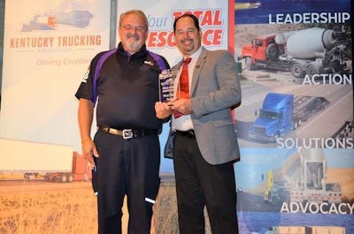 KTA Chairman Bill Hill, right, of Hill Transportation Services Inc., presents FedEx Freight driver David Proctor, left, with the first place trophy for the twin trailers category. (Image Courtesy of Kentucky Trucking Association)