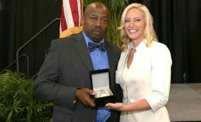 Shannon Newton, president of the Arkansas Trucking Association, presents Eddie Granger with his driver of the year award. (Arkansas Trucking Association photo)