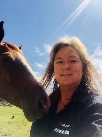 Ina Daly, pictured here with her horse Jessie, used to ride horses competitively. While she no longer competes, she still loves owning horses. (Image Courtesy of Ina Daly)