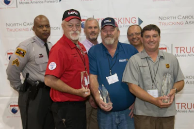 Pictured from the left are Sgt. K.E. Moore with the North Carolina Highway Patrol, third place flatbed class winner Andrew Truax with TCW, Inc., second place flatbed class winner Gene Bradshaw of Walmart Transportation and first place flatbed class winner Brian Walker of UPS. (Image Courtesy of North Carolina Trucking Association)