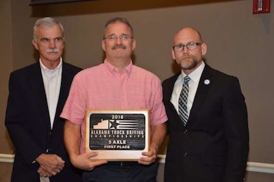 AAA Cooper Transportation's Mark Knight, center, won first place in the 5-Axle class. (Image Courtesy of Alabama Trucking Association/Facebook)