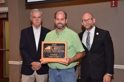 FedEx Freight's Cecil Salter, center, won first place in the 4-Axle class. (Image Courtesy of Alabama Trucking Association/Facebook)