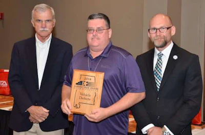 FedEx Freight's David Hawk, center, won the Pre-Trip Inspection award. (Image Courtesy of Alabama Trucking Association/Facebook)