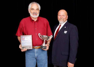 LaVern Reimer, left, a Walmart driver, was named grand champion after also winning first place in the 5-Axle class. (Image Courtesy of Oklahoma Trucking Association)