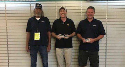 Russell Atkins, middle, was named the grand champion. Reddaway driver Jeffrey Payne, right, was second runner-up. Reddaway driver Dan Reese, left, was third runner-up. (Image Courtesy of Utah Trucking Association)