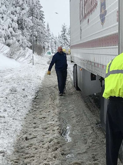 Aaron Shepherd, vice president of schools, checks out the truck during a March trip over Donner's Pass in California. (Image Courtesy of C.R. England)