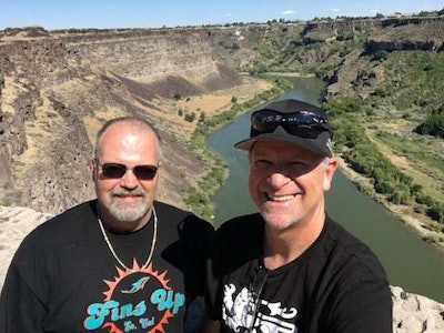 David Allred, right, C.R. England's director of management services, during a run with his co-driver and trainer Greg Trongale, left. (Image Courtesy of C.R. England)