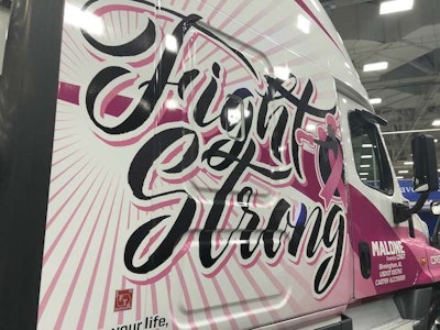 The truck features a black and white custom design and encourages on-lookers to 'Save a life, get a mammogram.'