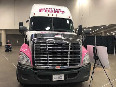 The front of the truck says to 'join the fight' against breast cancer.
