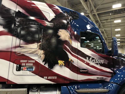 The trucks feature an American flag and Bald Eagle.
