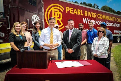 Hattiesburg Mayor Toby Barker, center left, and Dr. Adam Breerwood of Pearl River Community College, center right, stand with city and college staff after signing the CDL training agreement. (Image Courtesy of City of Hattiesburg)