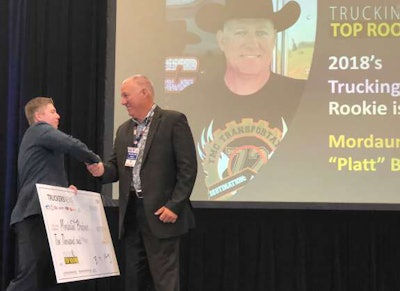 Randall-Reilly’s Seth Becker presents Platt Brabner with the winner’s check