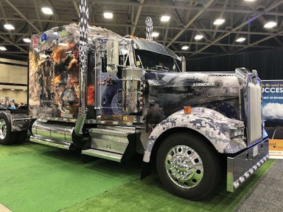 Traveloko has a truck with a military-themed wrap on display at GATS.