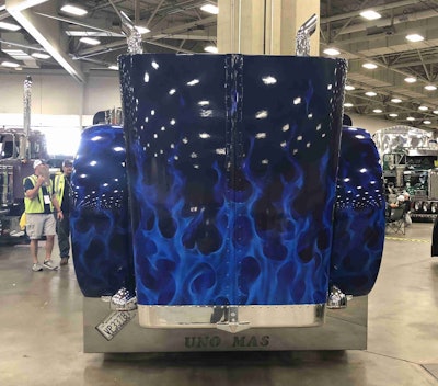 Blue flames are featured throughout the truck's design, including the hood.