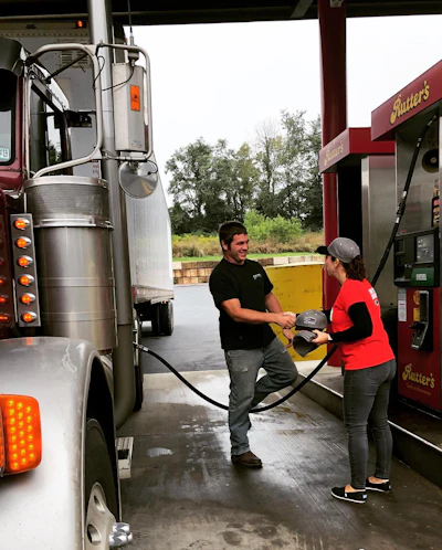 RoadPro's Gina Bonafede thanks a driver filling up at Rutters in Middletown.