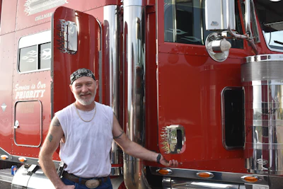 Alabama truck driver Phillip Clayton dedicated his company truck to country music artist and trucking industry singer-songwriter Red Simpson.