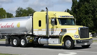 A McPherson Oil Products truck rolls through as part of the Alabama convoy for Special Olympics.