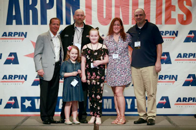 Bob Cordeiro, 2018 Driver of the Year for Arpin Van Lines, and his family and company officials. (Arpin photo)