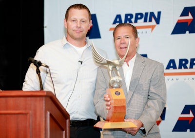 Rob Worcester, member of the WAA founding family and logistics team, presents the award to David Arpin, president and CEO of Arpin Van Lines. (Arpin photo)