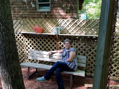 Debra Shew in her garden. Shew has always loved gardening and learned what to grow and how from her grandmother. (Image Courtesy of Debra Shew)