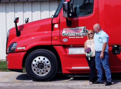 Emily and Mike were married at Dedicated Systems’ Green Bay terminal. The two are pictured above on their wedding day. (Image Courtesy of Emily Wolford)