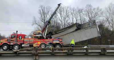 Workers recover a tractor-trailer that plunged into the Neuse River in North Carolina. (NCDOT photo)