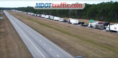 Traffic is backed up on I-10 in Mississippi because of a police standoff with a trucker.