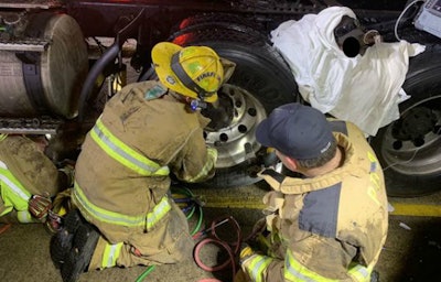 Firefighters extricated a man trapped between two semi tires in Plymouth Thursday, Jan. 17. (Photo: Lt. Nathan Lee, Livonia Fire Department)