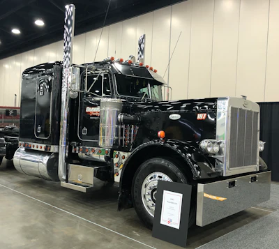 Dave Stewart, from Lafayette, Indiana, owns this 1987 Peterbilt 359. It has a 4 1/4 CAT and 15-speed transmission.