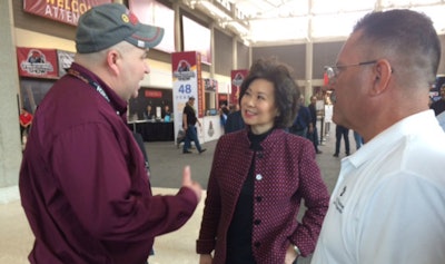 Transportation Secretary Elaine Chao and FNCSA Administrator Ray Martinez speak with one of the folks at MATS after her speech.