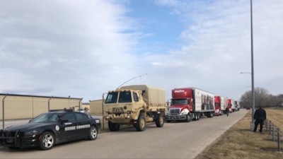 Trucks line up to deliver food to the community of Fremont, Nebraska. (Nebraska State Patrol photo)