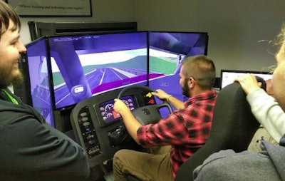 Students in Northeastern High School’s CDL prep class test drive a simulator. (Image Courtesy of Chad Forry/Northeastern High School)