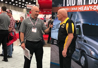 Lund International’s Vice President of Product Development Jason Gauci, left, recognizes truck driver Richard Nardone, right, during a ceremony at MATS.