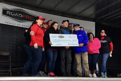 The RoadPro Family of Brands sponsored the Mother'sDay Convoy and presented the Make-A-Wish folks with $30,000.