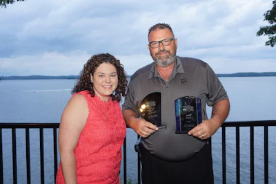 Keith Crook, right, is Georgia’s grand champion. Emily Crane, left, is the association’s director of events and member service. (Image Courtesy of Georgia Motor Trucking Association)
