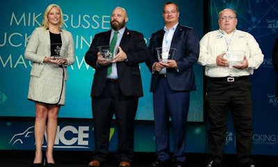 Accepting awards last year for their organizations were, left to right: Shannon Newton (Arkansas Trucking Association), Tony Bradley (Arizona Trucking Association accepting on behalf of Truckers Against Trafficking), John Elliott (Load One) and Herschel Evans (Holland). (John Sommers photo)