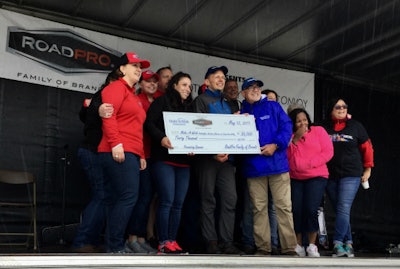 Representatives of the RoadPro Family of Brands and others presented a check to the Make-A-Wish foundation.